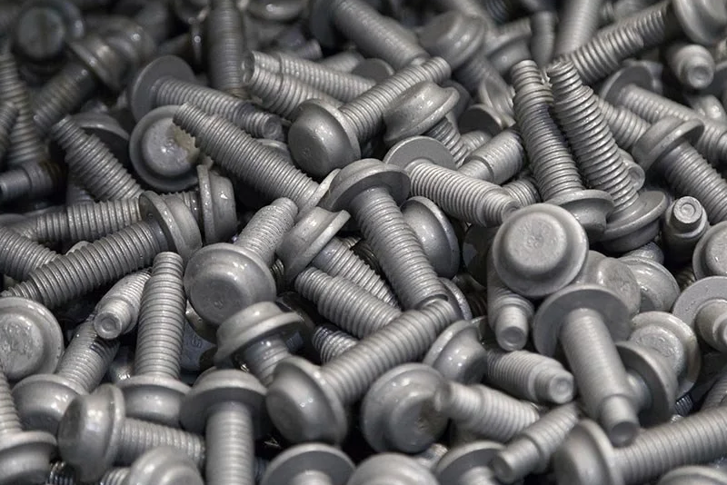 What is robotic zinc flake coating and how does it differ from manual coating?