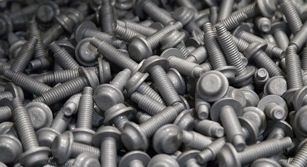 What is robotic zinc flake coating and how does it differ from manual coating?